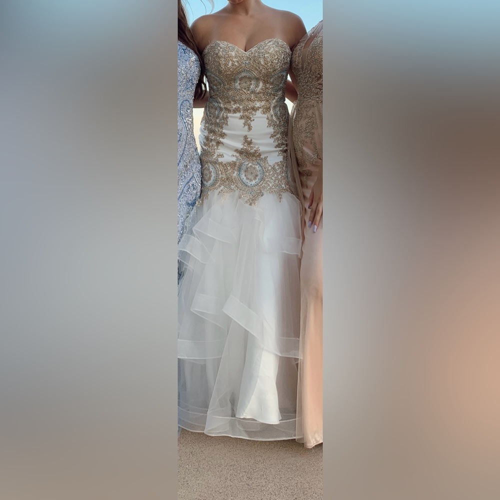 Strapless, corset back, beaded prom dress. Only been worn twice.